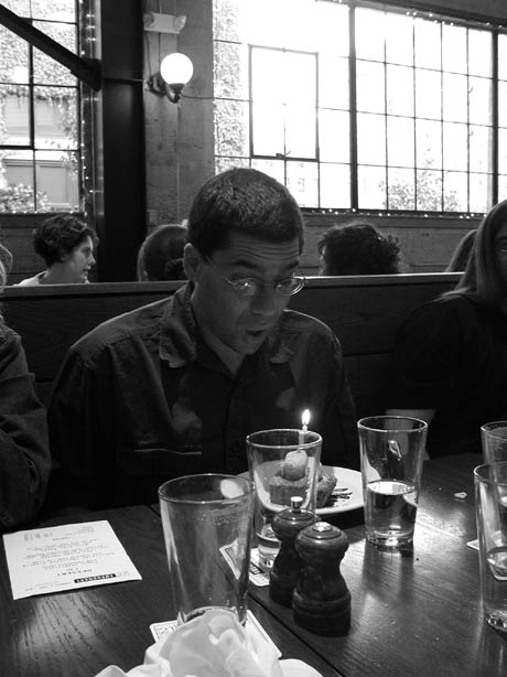 Tony Blows Out Candle